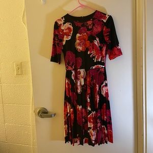Lovely Maggy London tea-length flower dress, black background